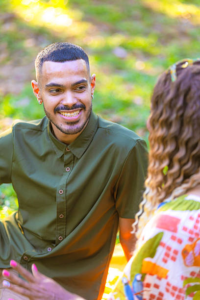 istock Couple talking on a date in the park 2241063573
