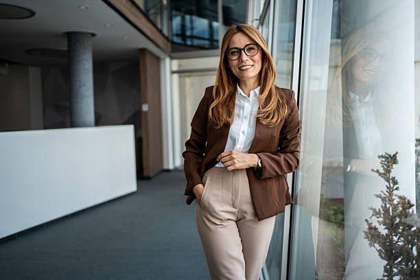 istock Professional businesswoman smiling in modern office environment 2241063616