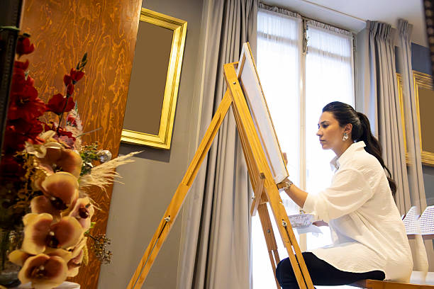 Woman working on a painting
