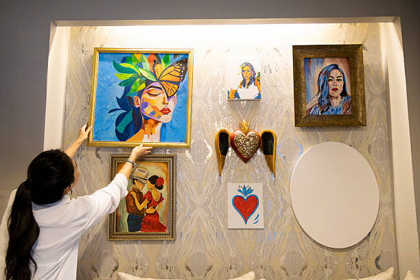 Woman hanging a new picture