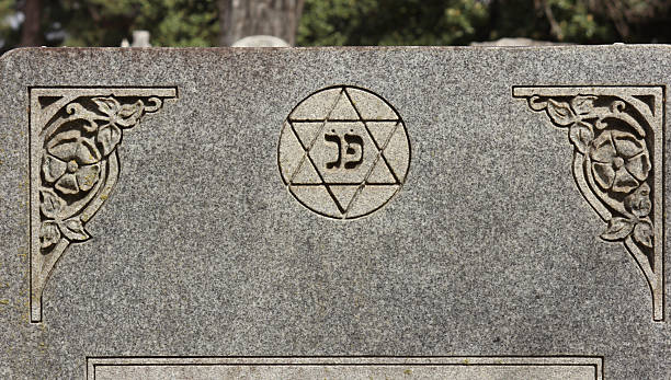 istock Headstone With Star of David and Hebrew Writing For Here Lies 2241068960