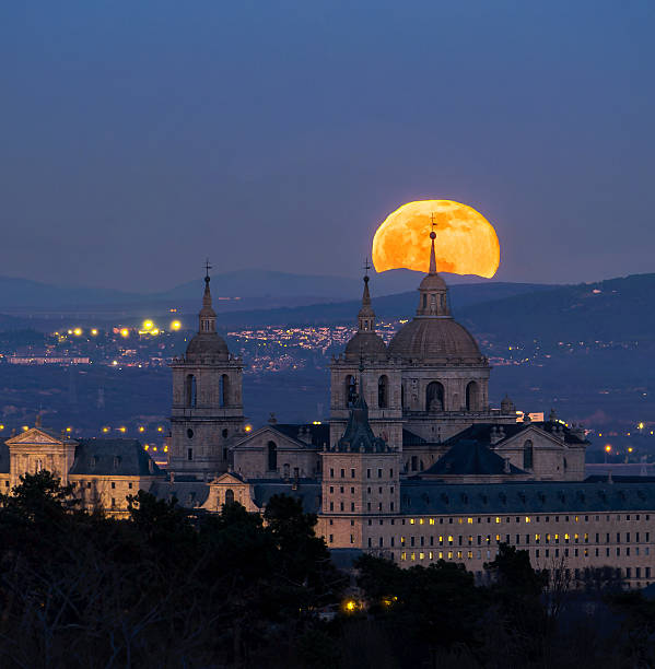 istock Full moon rising over El Escorial Monastery at dusk, Madrid, Spain 2241070471
