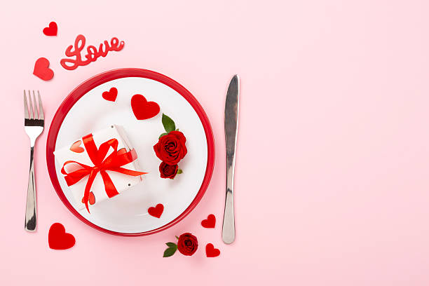 istock Table setting for Valentine's Day on color background, top view 2241072889