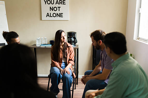 istock People participating in mental health support group therapy 2241075061