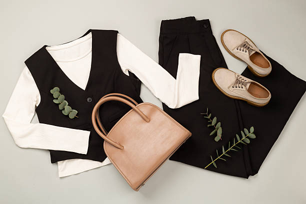 istock Flat lay with women's trendy spring outfit on gray background,, top view 2241076458