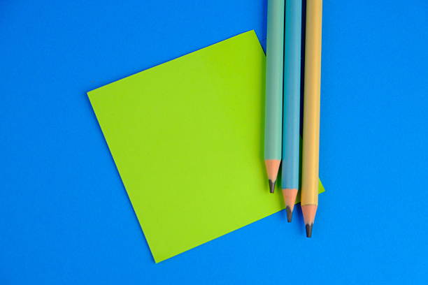 blank paper next to school tools with no word as a template for text space concept. business and education concept
