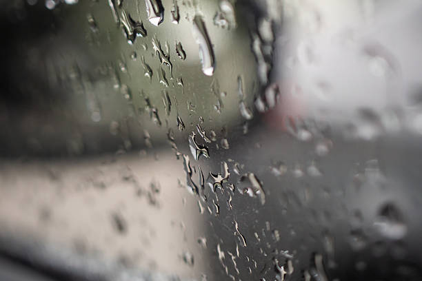 istock Wet raindrop on car glass window background 2241089924
