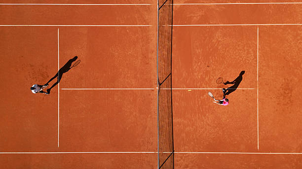 istock Two Athletes Practicing Tennis on Clay Court 2241090322