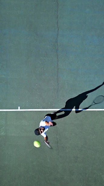 istock Tennis Player Practicing Serve on Hardcourt 2241090324