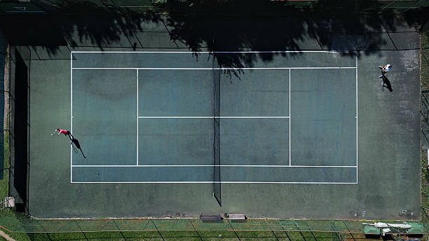 istock Two Tennis Players Practicing on Hardcourt 2241090325