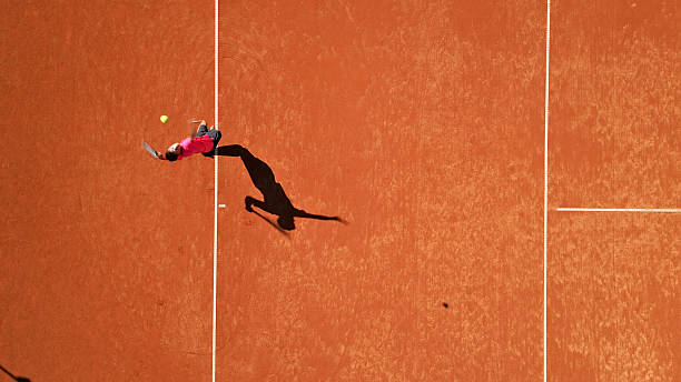 istock Tennis Player Stretches on Clay Court 2241090331