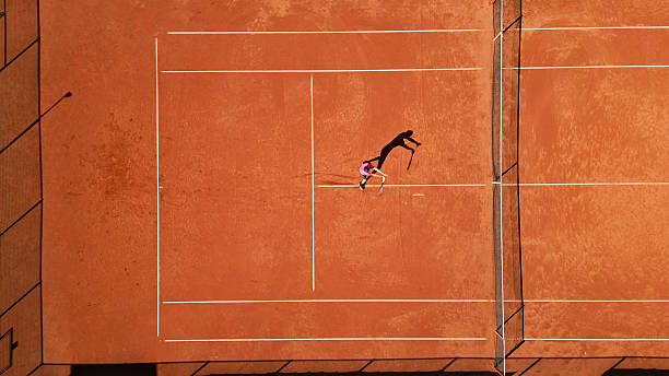 istock Tennis Player Practicing Dynamic Movement on Clay Court 2241090332