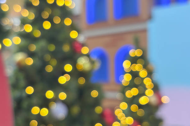 Abstract christmas holiday with festive gold bokeh light on tree blurred background