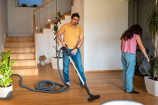 Woman vacuuming dust