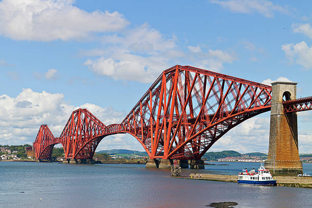 The Forth Bridge spans the Firth of Forth near South Queensferry in eastern Scotland. Completed in 1890, this red cantilever railway bridge remains one of the great engineering achievements of the Victorian era.