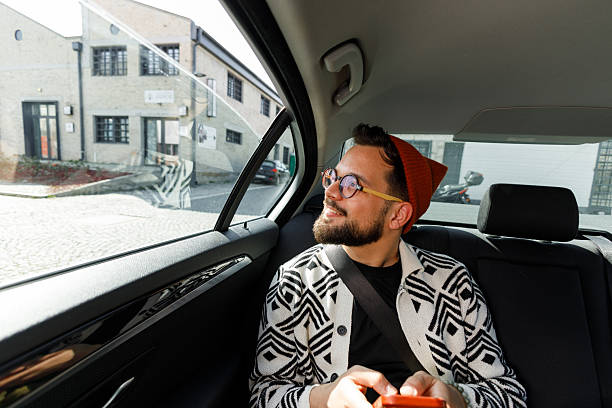 istock Man Having Video Call in Car Backseat 2241096121