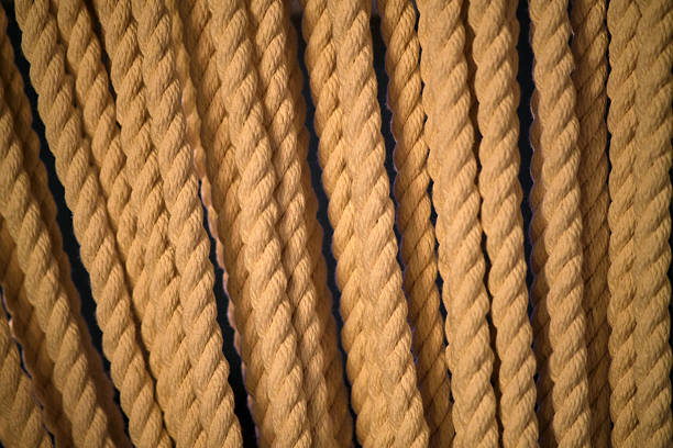A skein of old natural rope on a white background. Rope isolated on a white background.