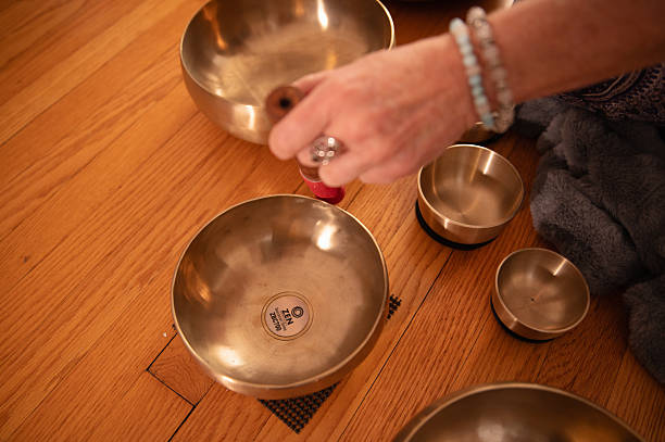 Practicing reiki with singing bowls for sound therapy in Kalamazoo, Michigan, United States