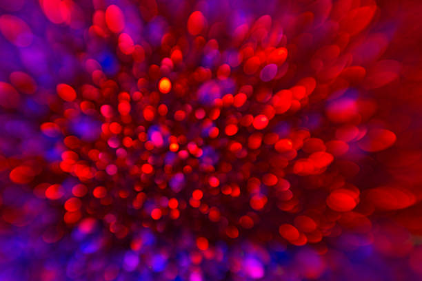 Glitter wallpaper with bokeh glow. Radiant glow sparkle background. Glitter effect. Glow texture. Vibrant background for greeting cards. Spark overlay for design templates. Glowing pattern with shine