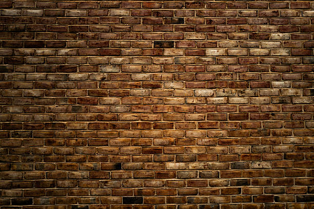 istock Old brick wall texture for background or wallpaper. Vintage masonry surface with bricks. Stone wall for design and construction themes. Rustic brickwork, wall backdrops. Old masonry wall. 2241107327