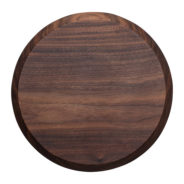 istock Handmade walnut round cutting board. wooden cutting board 2241110014