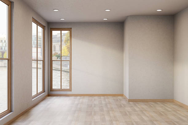 istock Empty bright mockup room with glass windows and ceiling lamp on white wall over wooden parquet floor 2241112346