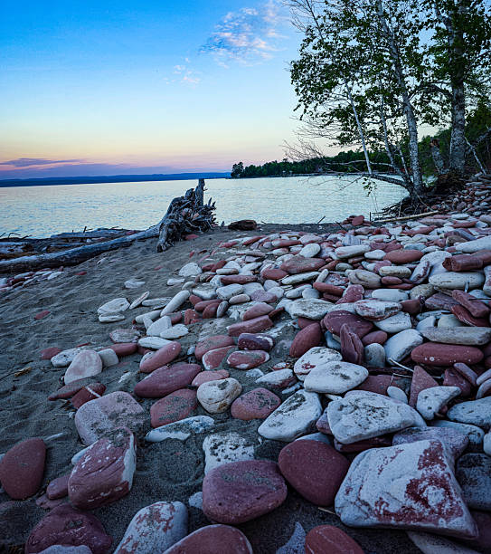 View of the pebble beach. Exterior of lake beach in Muskoka area of Ontario, Canada.