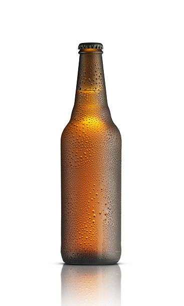 istock brown bottle with drops of beer 2241114235