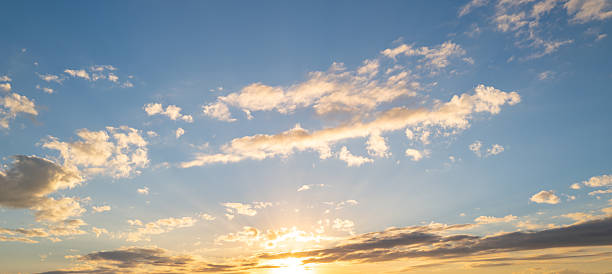 istock Sunrise Clouds background. Dramatic Clouds Sunset Background. Sky with clouds in Sunrise. Sunrise with clouds in various shapes background. Calm Cloud. 2241116227