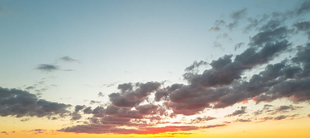 istock Sunset Clouds background. Dramatic Clouds Sunset Background. Sky with clouds in Sunrise. Sunrise with clouds in various shapes background. Calm Cloud. 2241116259
