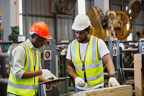 istock Teamwork engineer workers working check up iron product manufacturing in factory. Foreman in heavy Industrial workplace. 2241119579