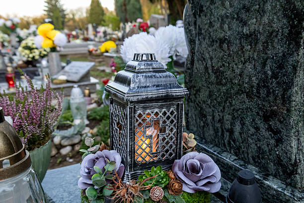 istock Memorial lantern with burning candle and floral tribute 2241120164