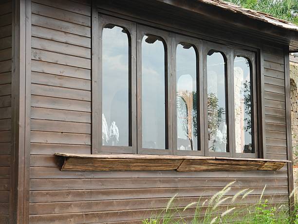 istock Wooden house and glass Windows 2241127896