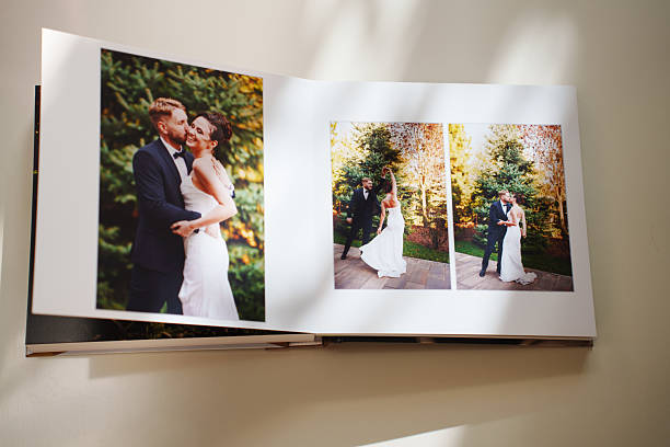 istock an open photo book with wedding photos on a white table 2241131261