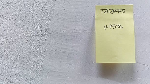 istock Sticky note on a cracked wall representing the effects of a tariff increase. 2241133127