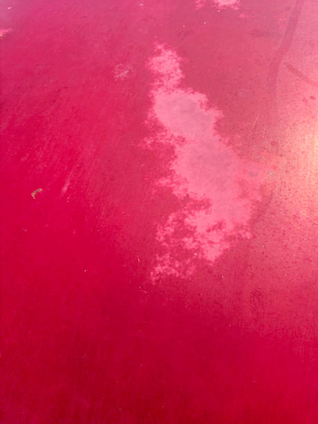 istock Faded and Oxidized Red Car Paint Surface Damaged by Sunlight and Weather Exposure 2241141744