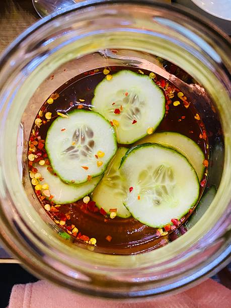 istock Pickled cucumber in chilly. Close-up 2241142749
