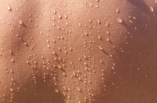 istock A person's back is wet with water 2241145625