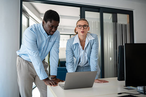 istock Business colleagues collaborating together at modern office desk 2241146199