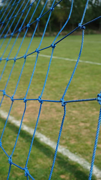 istock goal net on the green fields pitch 2241148653