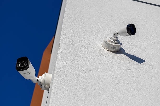istock High-tech security cameras installed on a building wall ensure safety and protection through constant monitoring of the area 2241149731