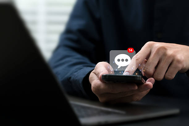 istock Businessman using smartphone to send email with notification, online communication concept.Email marketing concept. Company sending mass email or digital newsletter to customers. 2241150542