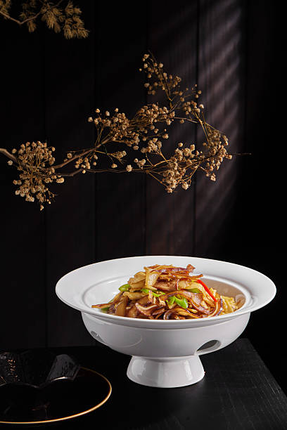 Slice the pig ears,White tableware for Chinese food in a Chinese restaurant, simple composition with floral background