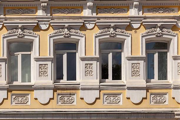 istock Historic building facade with four windows and stucco ornament 2241153232
