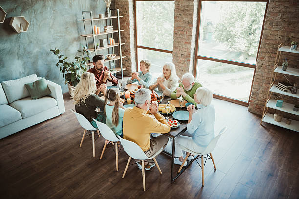 istock Generations gather for a warm thanksgiving feast around the table a lively family dinner filled with love joy and gratitude 2241154584
