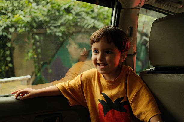 Schoolboy Getting a Ride to School By Car Wearing School Uniform Waving Goodbye.
