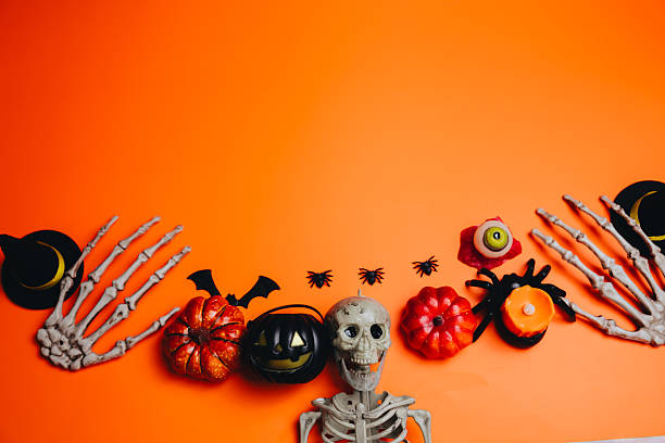 Halloween concept with a pumpkin and skeleton on background