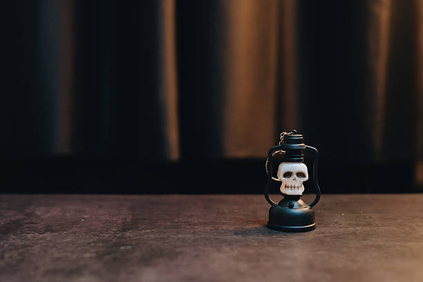 Halloween concept. Decorative lantern featuring a skull design, perfect for Halloween, gothic themes, or spooky home decor accents