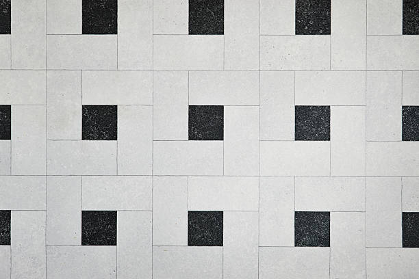 istock Geometric Tile Pattern With Light Gray Blocks And Black Squares Across The Wall Surface Texture 2241163943