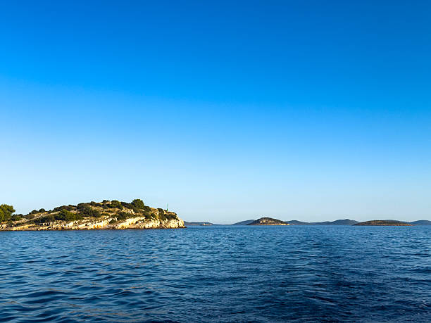 Azure Waters and Distant Islands Under a Clear Sky